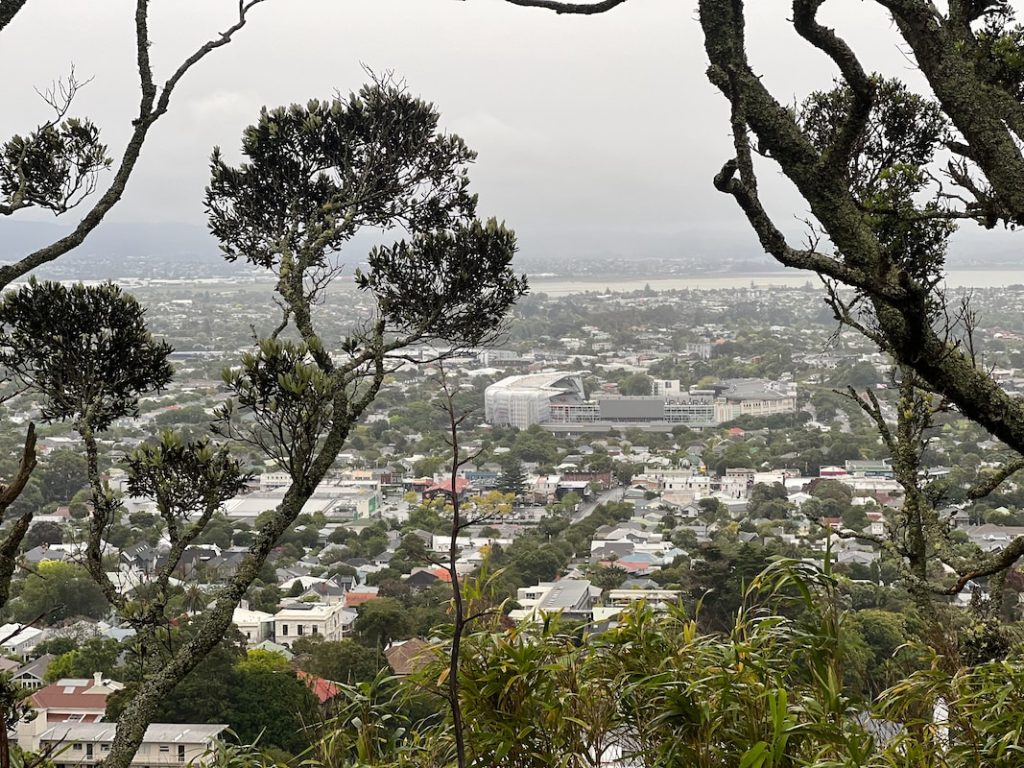 a view of a city from the top of a hill Mount Eden, New Zealand